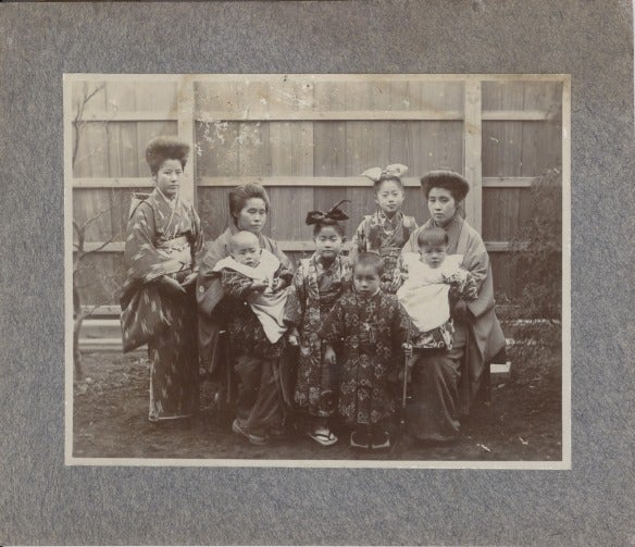 Item #16856 Photograph of Two Japanese Women with a Teenager and Five Children.