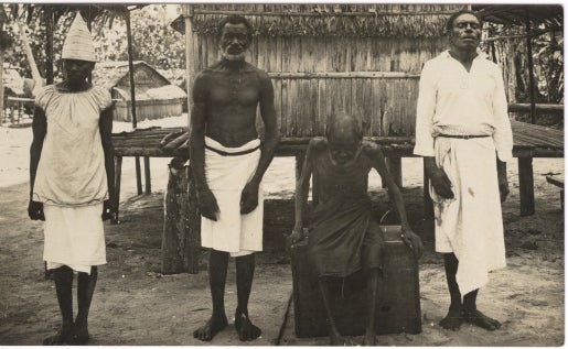 Item #16858 Photograph of Three Men and a Woman in Rabaul, Papua New Guinea.