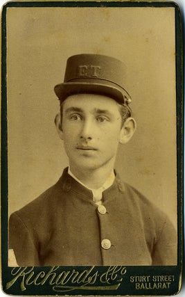 Item #17242 Carte de visite of young Australian man in uniform, with initials E. T. on his cap,...