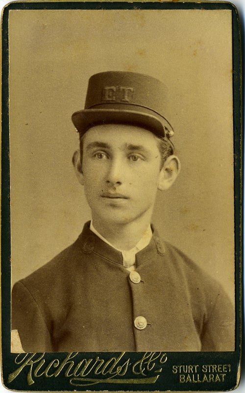 Item #17242 Carte de visite of young Australian man in uniform, with initials E. T. on his cap, possibly Electric Tramway.