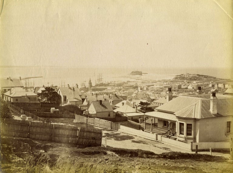 Item #18855 Newcastle, New South Wales. (Albumen photograph of a view across town towards Nobbys breakwater). Photographs, Henry King.