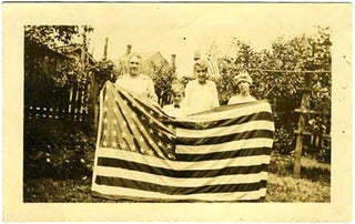 Item #20738 Family Holding Flag. Photograph