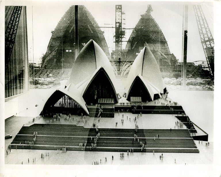 Item #22038 Sydney Opera House under construction: photograph of the architectural model juxtaposed in front of the Opera House under construction. Architecture, Joern Utzon.