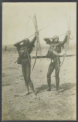 Item #23358 Real photo postcard of two Papua New Guinea tribesmen. New Guinea