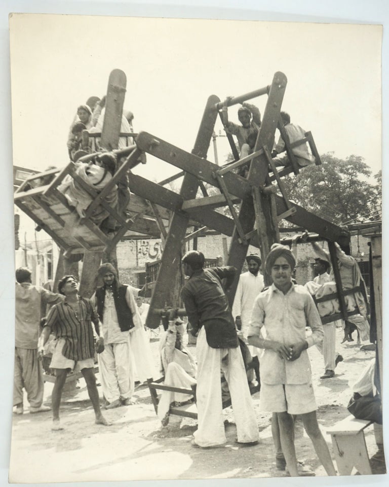 Item #27845 Photograph of a Hand made Wooden Ferris Wheel. India.