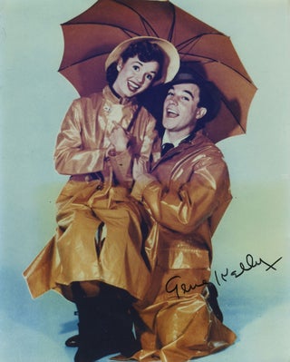 Item #28046 Singin' in the Rain movie still of Debbie Reynolds and Gene Kelly, signed. Gene...